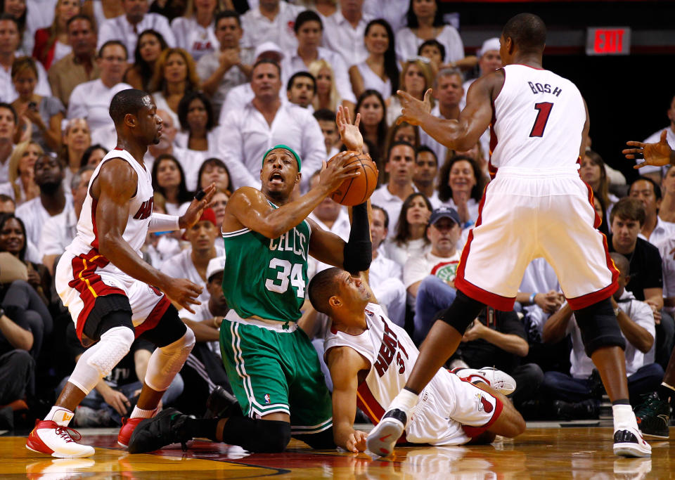 MIAMI, FL - JUNE 09: Paul Pierce #34 of the Boston Celtics looks to pass the ball as he is on his knees defended by Dwyane Wade #3 and Shane Battier #31 of the Miami Heat in the first half in Game Seven of the Eastern Conference Finals in the 2012 NBA Playoffs on June 9, 2012 at American Airlines Arena in Miami, Florida. (Photo by Mike Ehrmann/Getty Images)