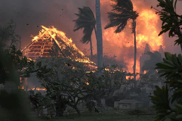 <p>Matthew Thayer/The Maui News via AP</p> The hall of historic Waiola Church in Lahaina and nearby Lahaina Hongwanji Mission are engulfed in flames along Wainee Street on Tuesday, Aug. 8, 2023, in Lahaina, Hawaii.