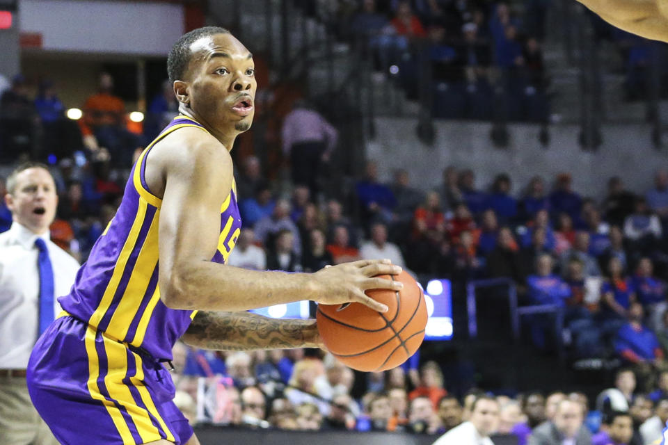 LSU guard Javonte Smart (1) looks over the Florida denense during the first half of an NCAA college basketball game in Gainesville, Fla., Wednesday, March 6, 2019. (AP Photo/Gary McCullough)