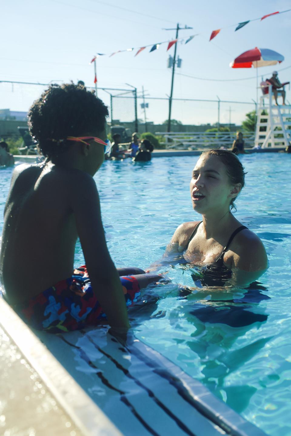 An instructor teaches a student how to swim as part of a program with Tankproof, which offers free swimming lessons to underserved communities in Seattle, San Francisco, Los Angeles, Dallas, Austin, Baton Rouge, Brooklyn and Nashville.