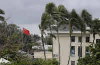 The Chinese flags flies at their embassy in Nuku'alofa, Tonga, Monday April 8, 2019. China wants 10 small Pacific nations to endorse a sweeping agreement covering everything from security to fisheries in what one leader warns is a “game-changing” bid by Beijing to wrest control of the region. (AP Photo/Mark Baker)