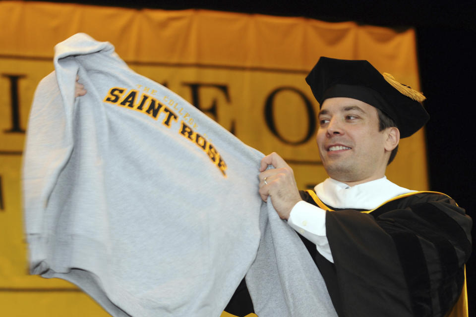 FILE - "Tonight Show" host Jimmy Fallon displays his alma mater's sweatshirt during the College of Saint Rose's 86th Annual Commencement at the Saratoga Performing Arts Center, in Saratoga Springs, N.Y., May 9, 2009. The College of Saint Rose, a small Roman Catholic college in Albany, NY, will close in May 2024 after years of financial struggles, officials said. (AP Photo/Hans Pennink, File)