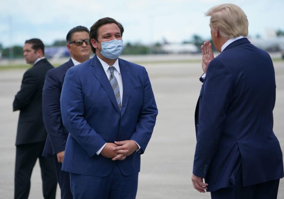 <div class="inline-image__caption"><p>US President Donald Trump speaks with Governor of Florida Ron DeSantis in September 2020.</p></div> <div class="inline-image__credit">MANDEL NGAN</div>