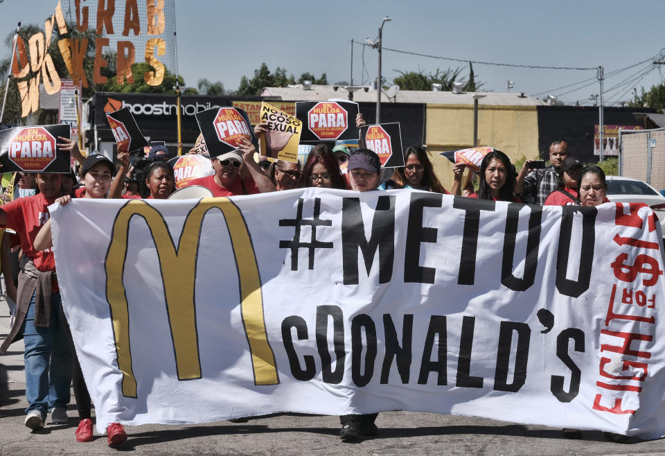 <p> McDonald's workers carry a banner and march towards a McDonald's in south Los Angeles on Tuesday, Sept. 18, 2018. McDonald’s workers staged protests in several cities Tuesday as part of what organizers billed as the first multistate strike seeking to combat sexual harassment in the workplace. (AP Photo/Richard Vogel) </p>