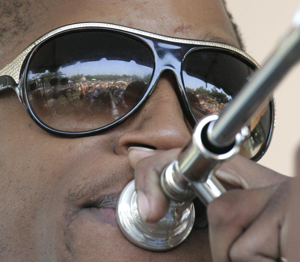 FILE - In this April 21, 2007 file photo, Troy "Trombone Shorty" Andrews performs in New Orleans. April marks the start of spring festival season in south Louisiana. As the revelry of Mardi Gras and chill of winter end, spring festivals usher in the flip-flops, floppy hats and folding chairs toted by music lovers from across the globe. French Quarter Festival and Jazz Fest in New Orleans, and Festival International de Louisiana in Lafayette, La., are all held in April. Other Louisiana festivals held in spring and summer include Bayou Country Superfest in May, New Orleans Cajun-Zydeco Festival in June, Essence Music Festival in July and Satchmo Summerfest in August. (AP Photo/Bill Haber, File)