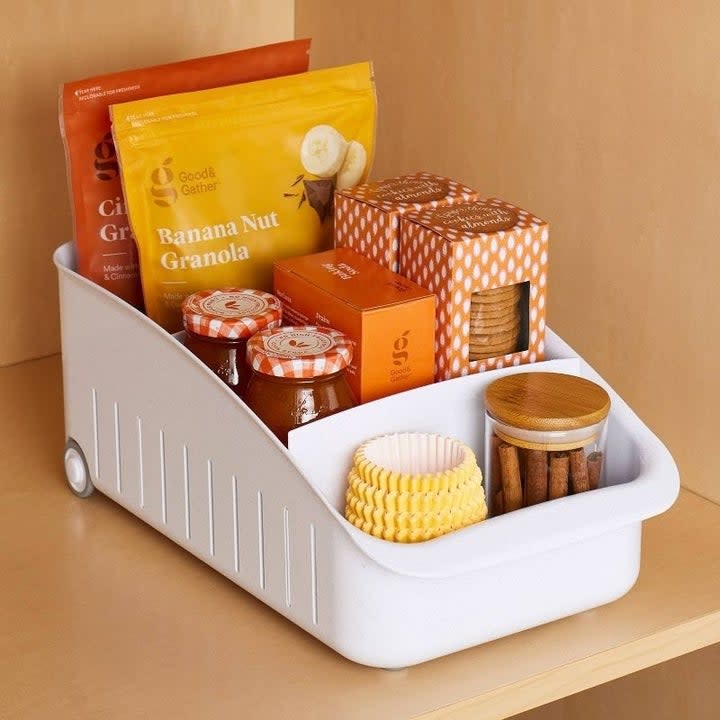 A snack organizer on a shelf