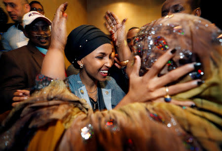 Democratic congressional candidate Ilhan Omar is greeted by her husband’s mother after appearing at her midterm election night party in Minneapolis, Minnesota, U.S. November 6, 2018. REUTERS/Eric Miller