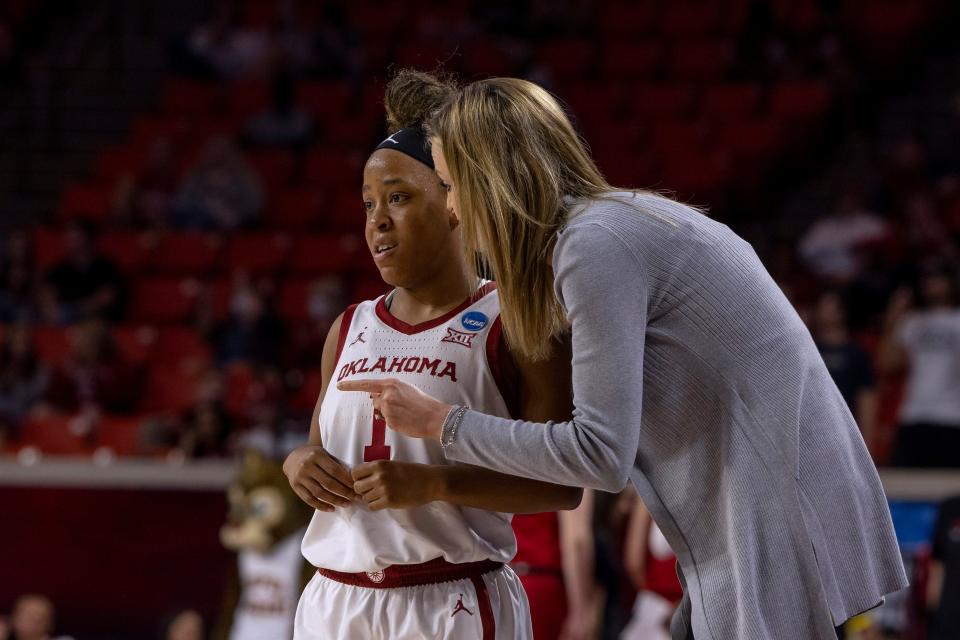 Oklahoma coach Jennie Baranczyk talks with Nevaeh Tot during the second half of a first-round game against IUPUI in the NCAA women's college basketball tournament Saturday, March 19, 2022, in Norman, Okla. (AP Photo/ Mitch Alcala)