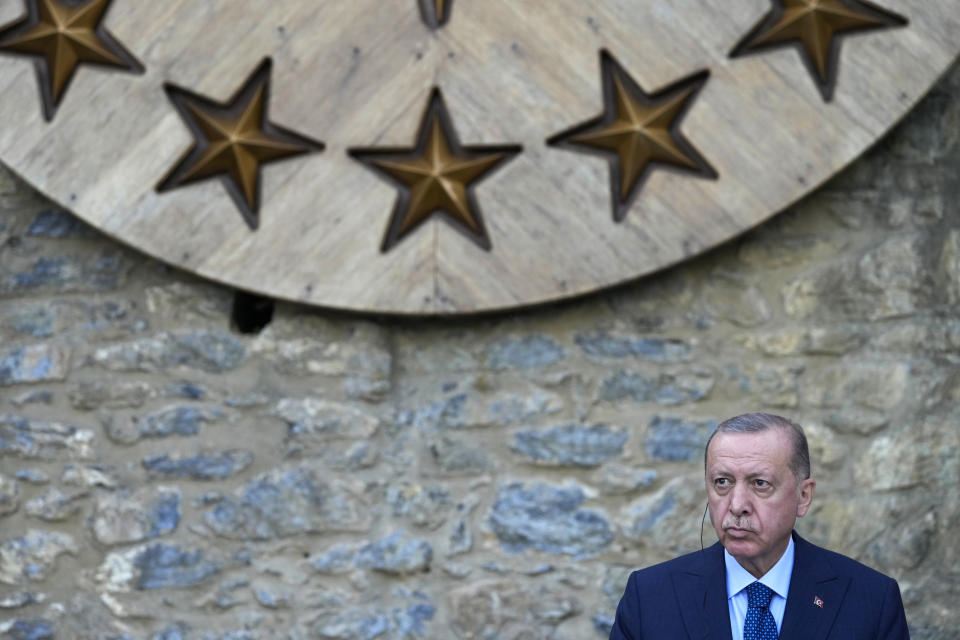 Turkey's President Recep Tayyip Erdogan listens to German Chancellor Angela Merkel during a joint news conference following their meeting at Huber Villa presidential palace in Istanbul, Turkey, Saturday, Oct. 16, 2021. The leaders discussed Ankara's relationship with Germany and the European Union as well as regional issues including Syria and Afghanistan. (AP Photo/Francisco Seco)