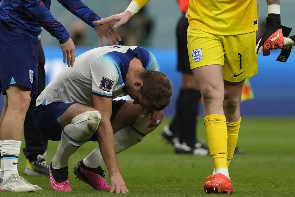 England's Harry Kane reacts after the World Cup quarterfinal soccer match between England and France, at the Al Bayt Stadium in Al Khor, Qatar, Sunday, Dec. 11, 2022. (AP Photo/Frank Augstein)