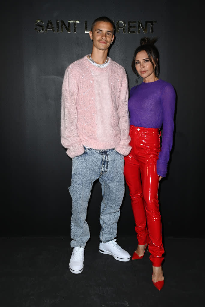 Romeo Beckham and Victoria Beckham attended the Saint-Laurent Womenswear Fall/Winter 2022/2023 show as part of Paris Fashion Week. (Getty Images)