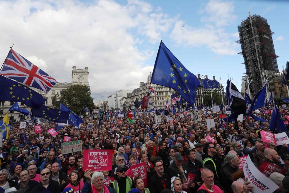 Demonstrators with placards and EU and Union flags gather in Parliament Square in central London (AFP via Getty Images)