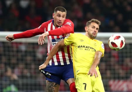 Soccer Football - Copa del Rey - Round of 16 - Second Leg - Atletico Madrid v Girona - Wanda Metropolitano, Madrid, Spain - January 16, 2019 Atletico Madrid's Jose Gimenez in action with Girona's Cristhian Stuani REUTERS/Sergio Perez