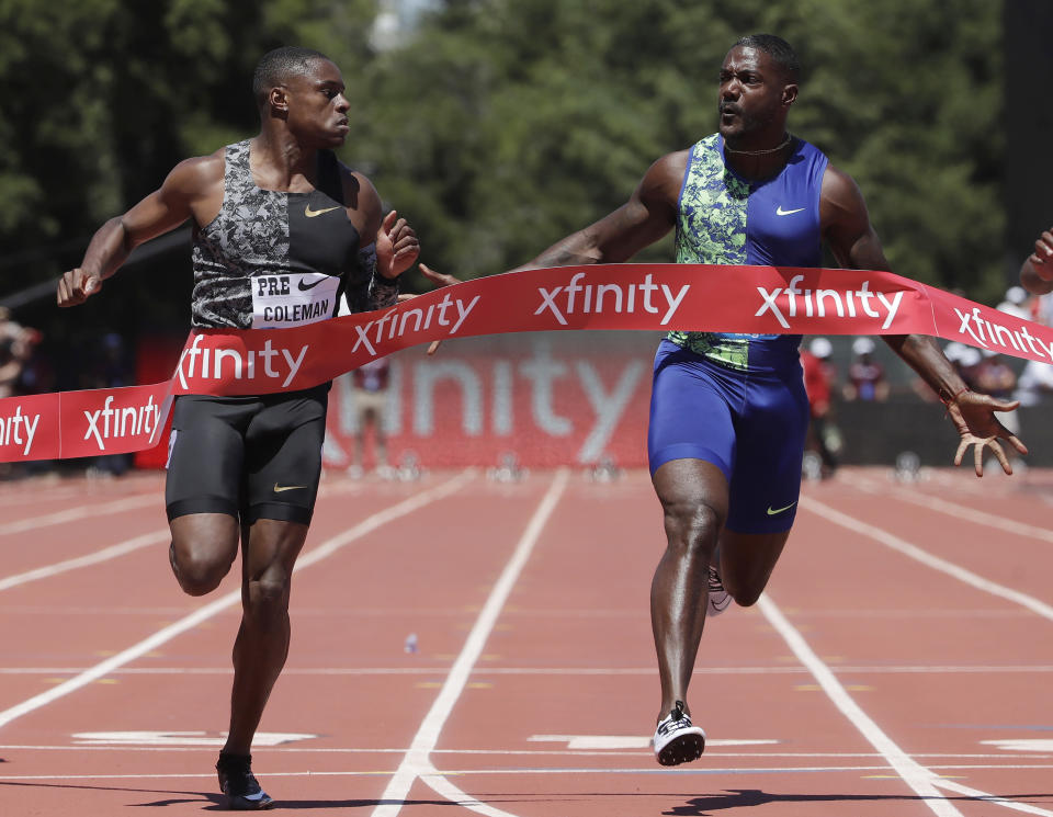 FILE - In this June 30, 2019, file photo, Christian Coleman, left, of the United States, wins the 100-meter race as he looks towards compatriot Justin Gatlin during the Prefontaine Classic athletics meet in Stanford, Calif. Now that Usain Bolt's gone, the top two contenders in the 100-meter final are expected to be Coleman and defending champion Justin Gatlin. (AP Photo/Jeff Chiu, File)