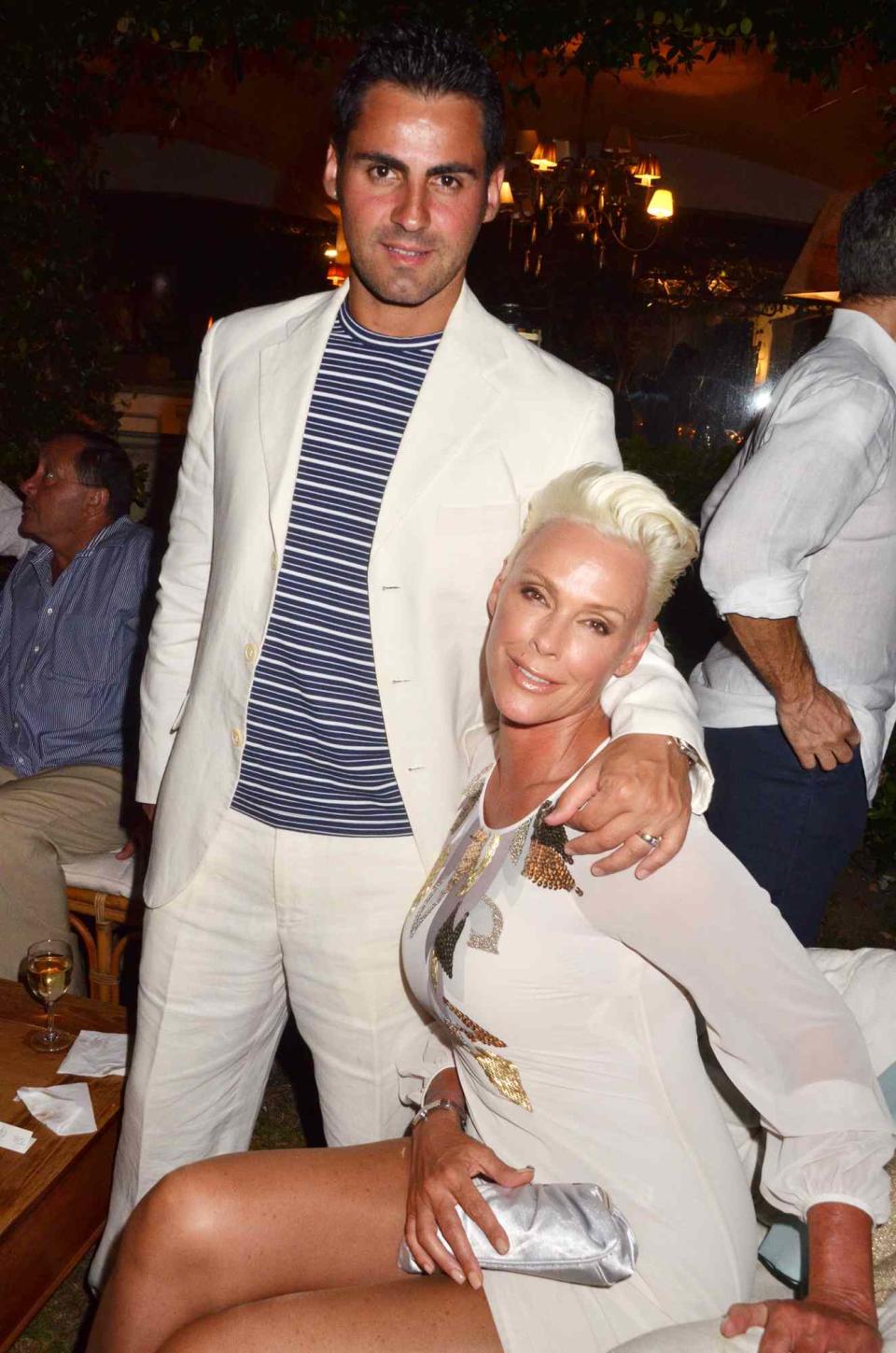 Mattia Dessi and his wife Brigitte Nielsen attend the Massimo Gargia Summer Party at Les Moulins de Ramatuelle on August 18, 2011 in Saint Tropez, France