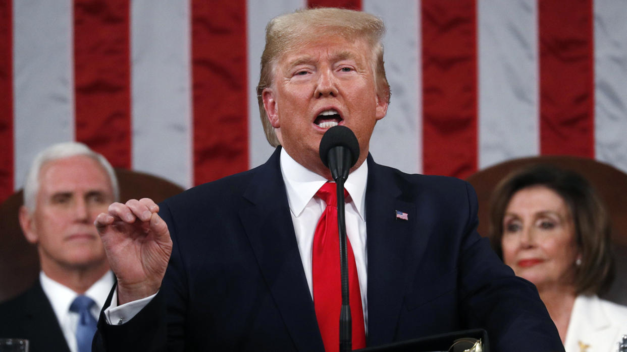 President Donald Trump delivers his State of the Union address to a joint session of Congress in the House Chamber on Capitol Hill in Washington on Feb. 4, 2020, as Vice President Mike Pence and Speaker Nancy Pelosi look on. (Leah Millis/Pool via AP)