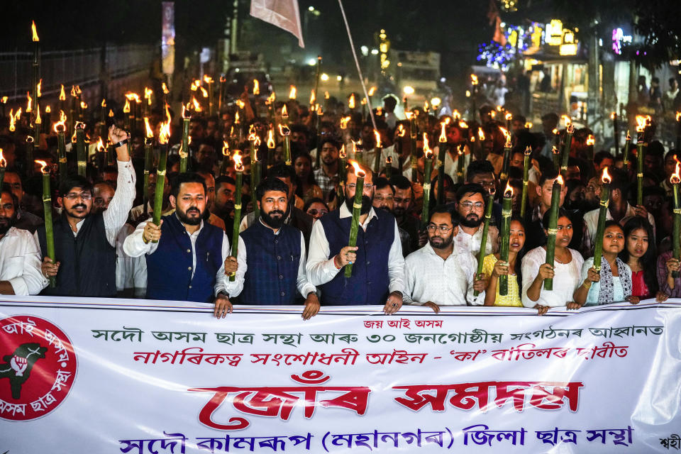 All Assam Students Union (AASU) members take out a torch procession to protest against the Citizenship Amendment Act (CAA) in Guwahati, India, Tuesday, March 12, 2024. India has implemented a controversial citizenship law that has been widely criticized for excluding Muslims, a minority community whose concerns have heightened under Prime Minister Narendra Modi's Hindu nationalist government. The act provides a fast track to naturalization for Hindus, Parsis, Sikhs, Buddhists, Jains and Christians who fled to Hindu-majority India from Afghanistan, Bangladesh and Pakistan before Dec. 31, 2014. (AP Photo/Anupam Nath)