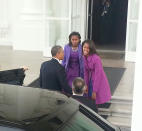 President Obama shares a laugh with his daughters at the White House Malia shouted "boo!" at her father as he exited his limo. "You scared me!" he joked back. (Rachel Rose Hartman/Yahoo News)