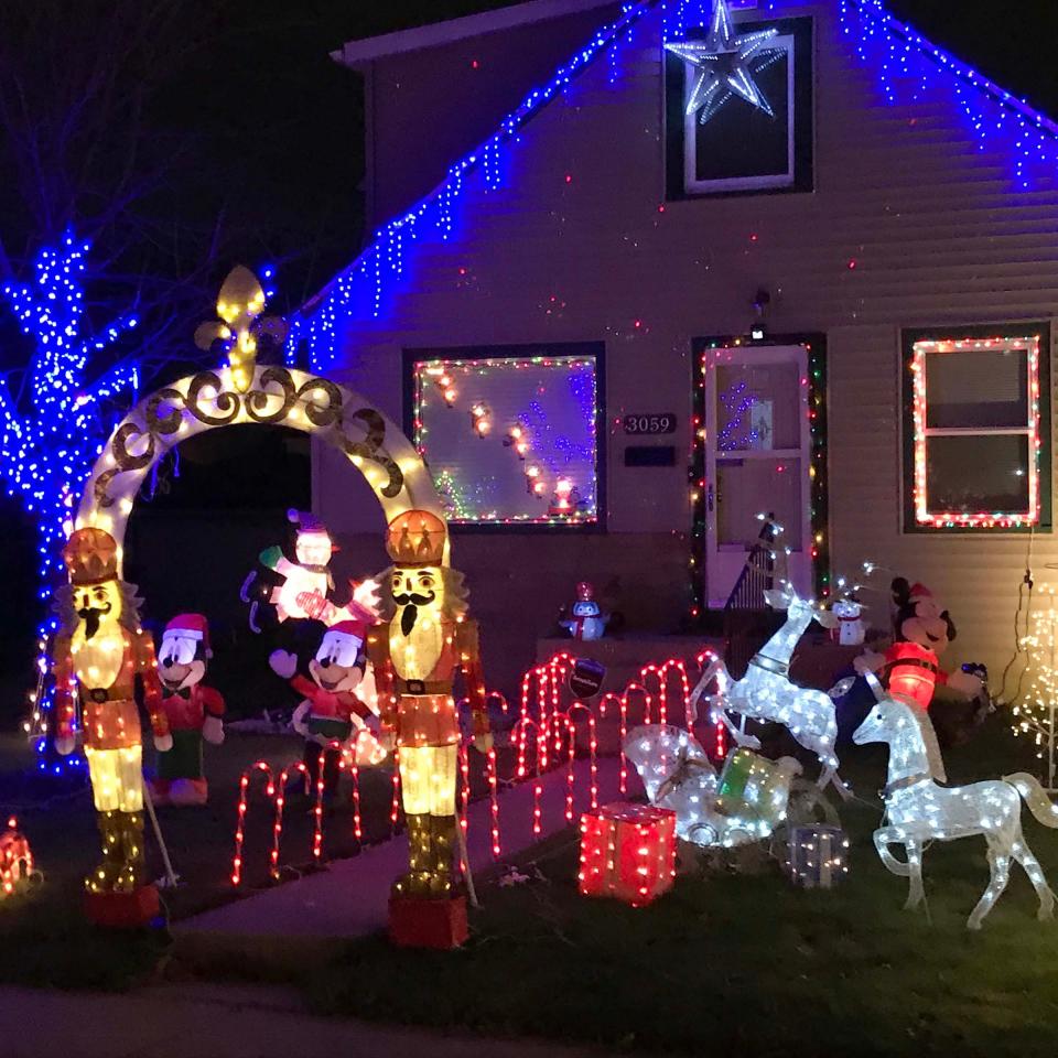 A home is decked out in Christmas decorations at Candy Cane Lane in West Allis Sunday, Nov. 29, 2020.