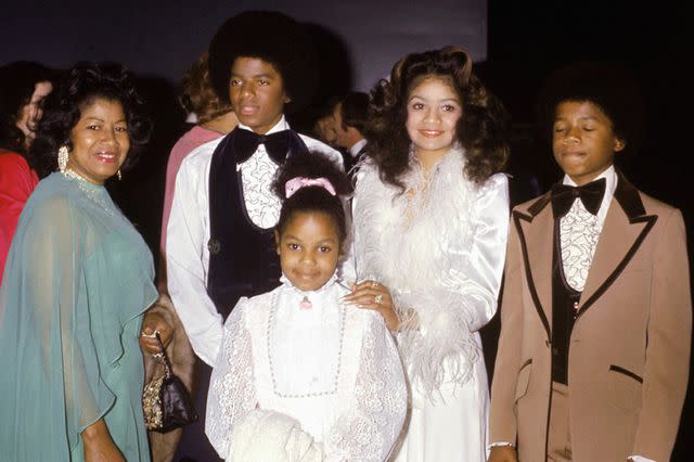 <p>Michael Ochs Archives/Getty</p> Michael Jackson with his mother Katherine, sisters Janet and La Toya and brother Randy at the wedding of older brother Jermaine Jackson on December 15, 1973.
