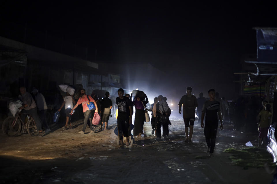 Palestinians displaced by the Israeli air and ground offensive on the Gaza Strip flee from parts of Khan Younis following an evacuation order by the Israeli army to leave the eastern part of Gaza Strip's second largest city on Monday, July 1, 2024. (AP Photo/Jehad Alshrafi)