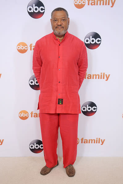 Laurence Fishburne in a red linen suit.