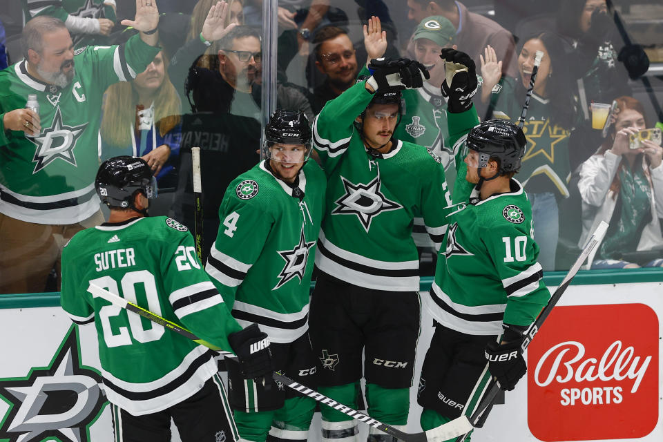 Dallas Stars forward Mason Marchment, second from right, is congratulated after scoring a goal against the Toronto Maple Leafs during the second period of an NHL hockey game Thursday, Oct. 26, 2023, in Dallas. (AP Photo/Brandon Wade)