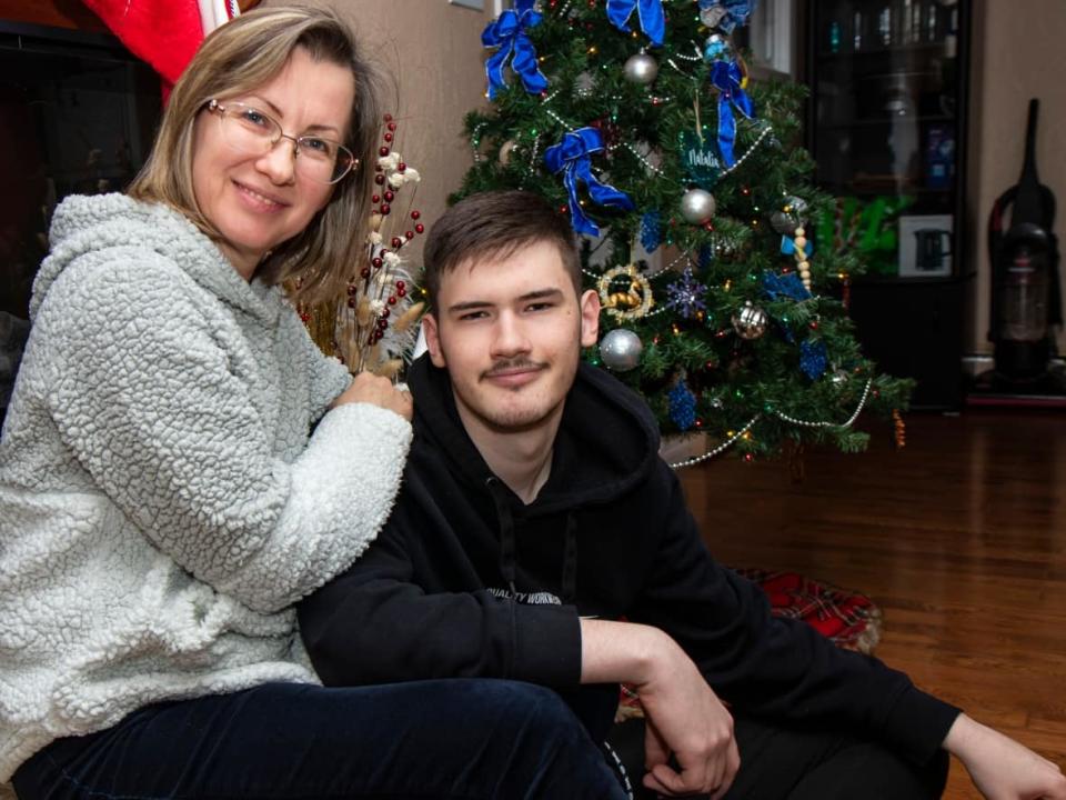 Natalia Kohanova, left, and her son Mykhailo Kohanov mark Orthodox Christmas in Brandon, Man., on Friday. They arrived in Canada in June, as the war in Ukraine devastated their hometown of Irpin. (Chelsea Kemp/CBC - image credit)