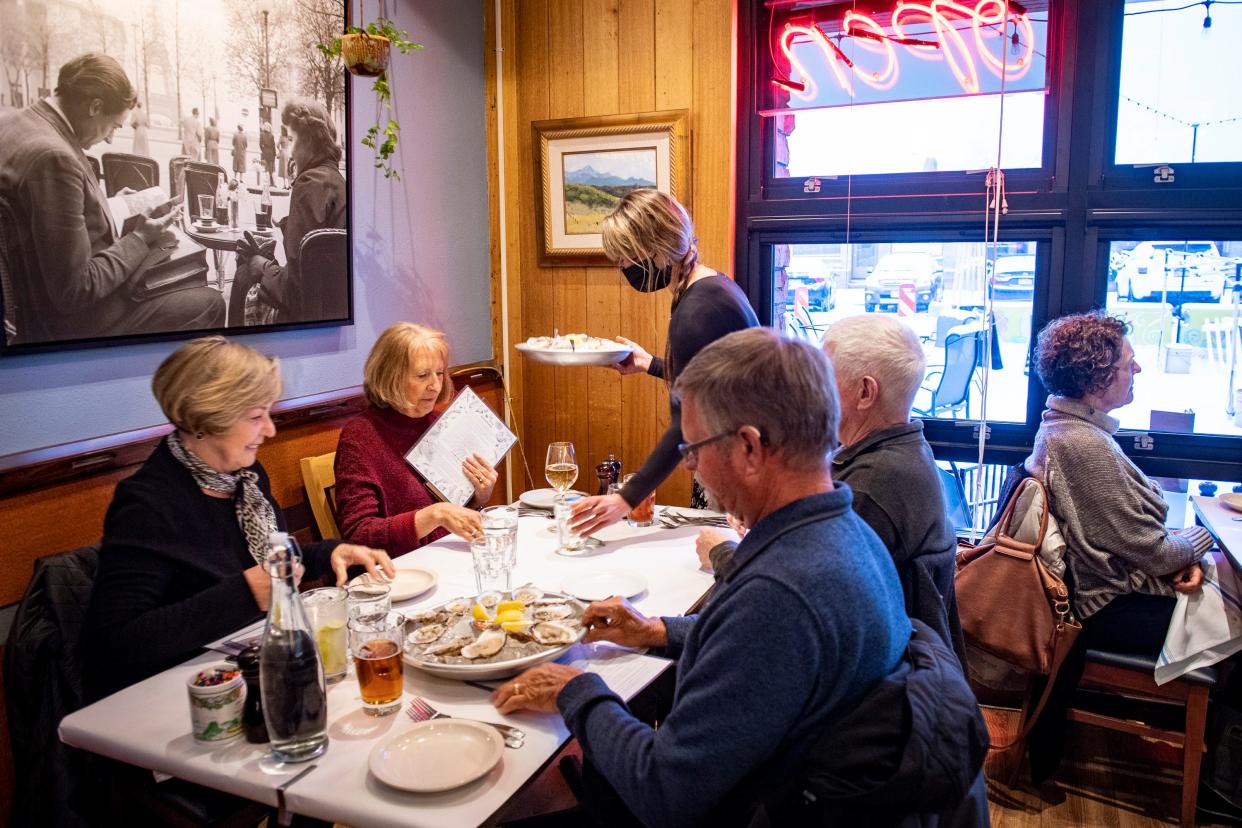 Patrons at Bistro Nautile are pictured during dinner service on March 9, 2022. The owners of Bistro Nautile, a French-inspired bistro at 150 W. Oak St., recently took over the lease at The Fox and the Crow — a cheese and meat shop that shuttered last month after nearly a decade in the Scotch Pines Village Shopping Center.