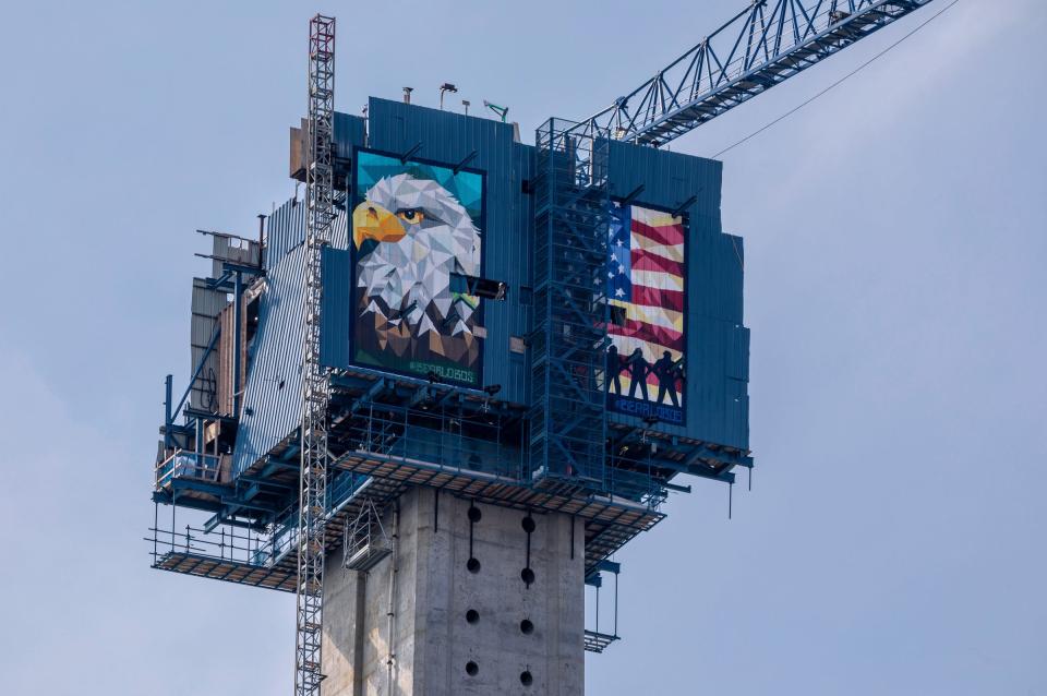 A bald eagle and an American flag are painted on the Gordie Howe International Bridge in Detroit on Tuesday, Aug. 8, 2023. 