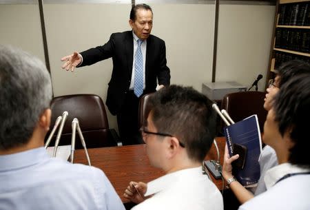 Universal Entertainment Corp's founder Kazuo Okada (C) attends a news conference at the Tokyo District Court in Tokyo, Japan September 14, 2017. REUTERS/Issei Kato