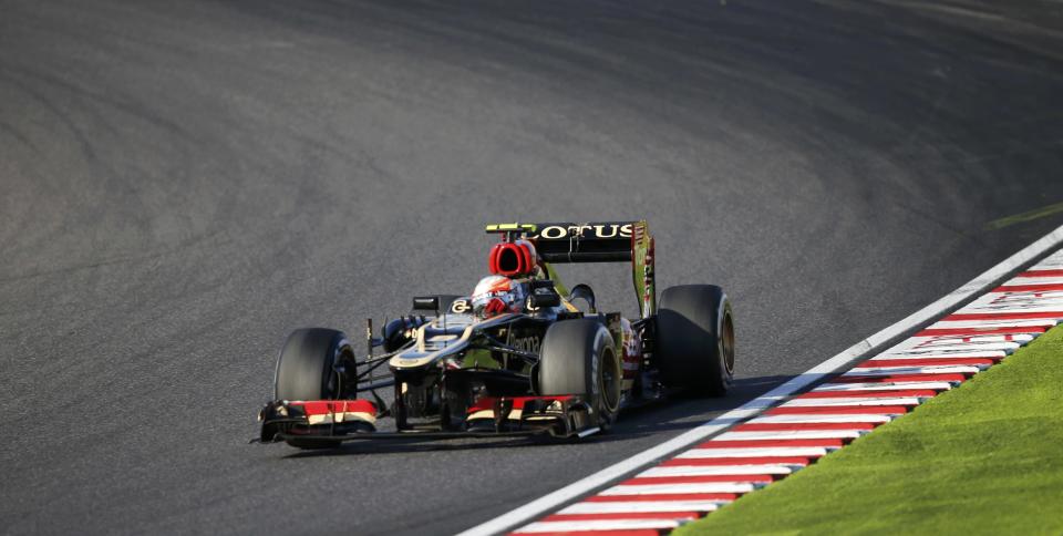 Lotus Formula One driver Romain Grosjean of France races during the Japanese F1 Grand Prix at the Suzuka circuit October 13, 2013. REUTERS/Issei Kato (JAPAN - Tags: SPORT MOTORSPORT F1)