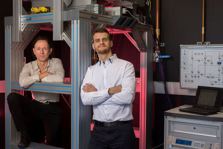 Quantum computation engineers Andrea Morello (L) and Guilherme Tosi from the University of New South Wales are photographed in this handout imaged in Sydney, Australia, July 24, 2017. Picture taken July 24, 2017. University of New South Wales/Quentin Jones/Handout via REUTERS