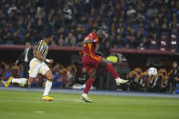 Roma's Romelu Lukaku, right, shoots the ball during the Serie A soccer match between Roma and Juventus, at Rome's Olympic Stadium, Sunday, May 5, 2024. (AP Photo/Andrew Medichini)