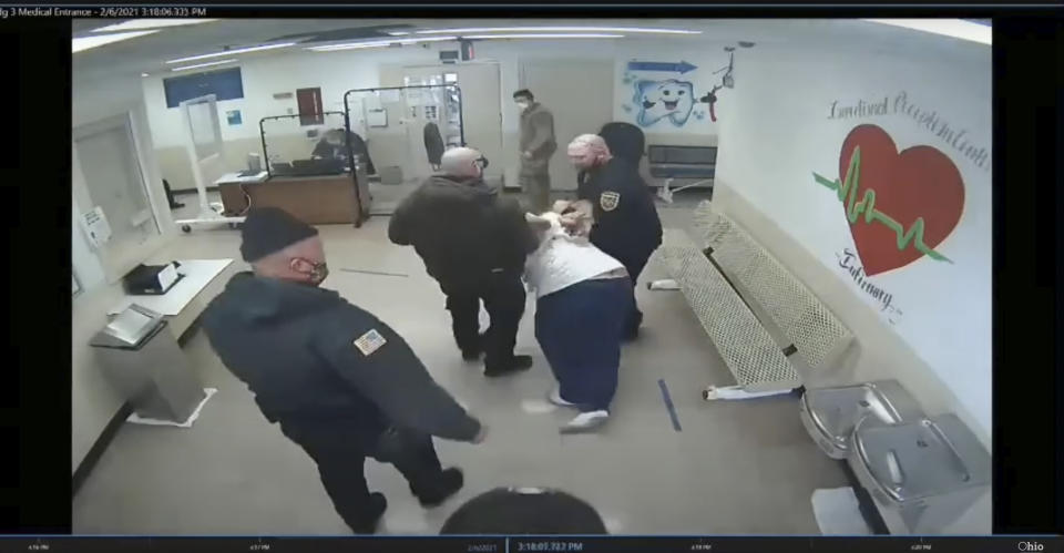 In this image made from video, prison guards escort Michael McDaniel, 55, to the medical facility at the Correctional Reception Center in Orient, Ohio. Ohio’s correctional agency has terminated seven employees after officials say prison guards used excessive and unjustified force against a Black inmate before he died in custody in February. The Ohio Department of Rehabilitation & Correction sent a notice of removal to five corrections officers, a supervisor and a licensed nurse following an investigation into the in-custody death of 55-year-old Michael McDaniel. (Ohio Department of Rehabilitation and Correction via AP)