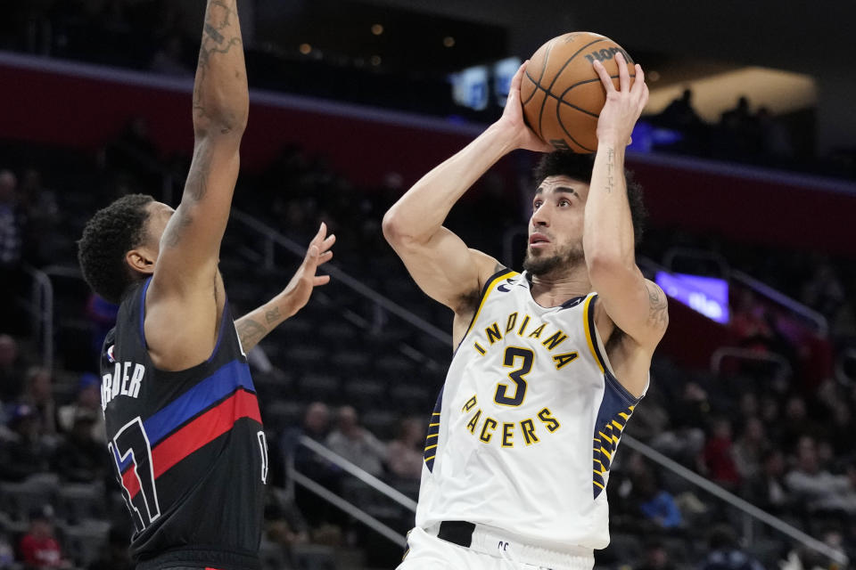 Indiana Pacers guard Chris Duarte (3) shoots over the defense of Detroit Pistons guard Rodney McGruder (17) during the second half of an NBA basketball game, Monday, March 13, 2023, in Detroit. (AP Photo/Carlos Osorio)