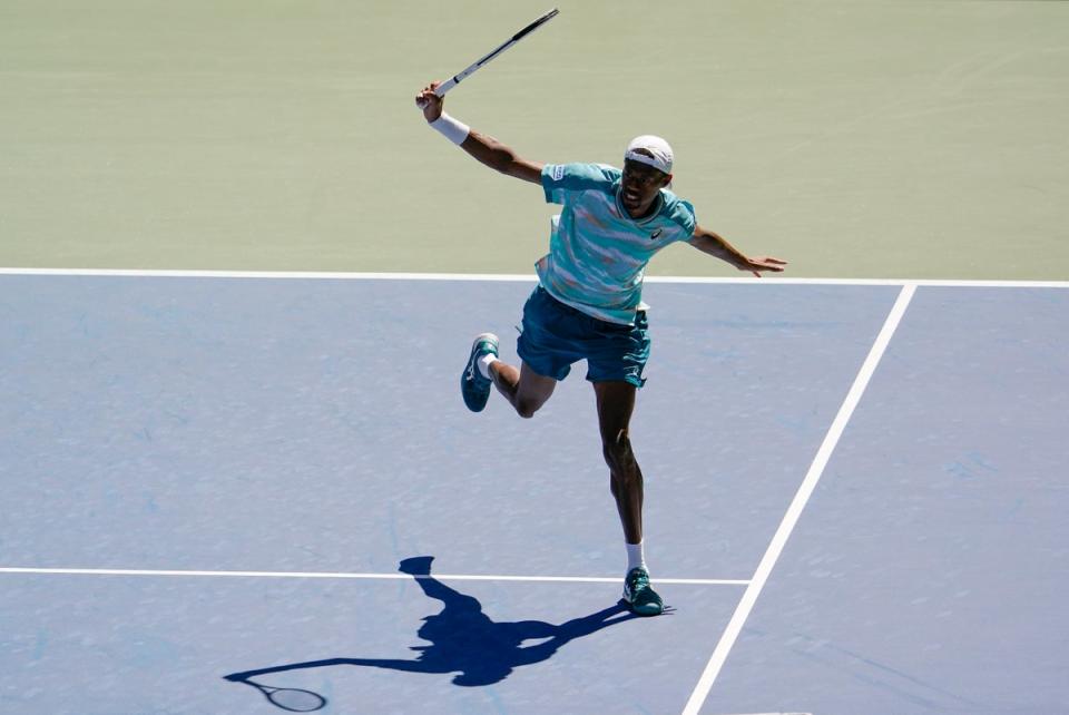 Christopher Eubanks strikes a flamboyant backhand in his defeat by Jannik Sinner (Seth Wenig/AP) (AP)