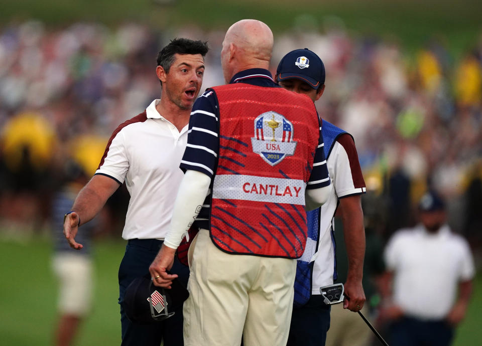 Rory McIlroy and Joe LaCava exchange points of view. (Mike Egerton/PA Images via Getty Images)