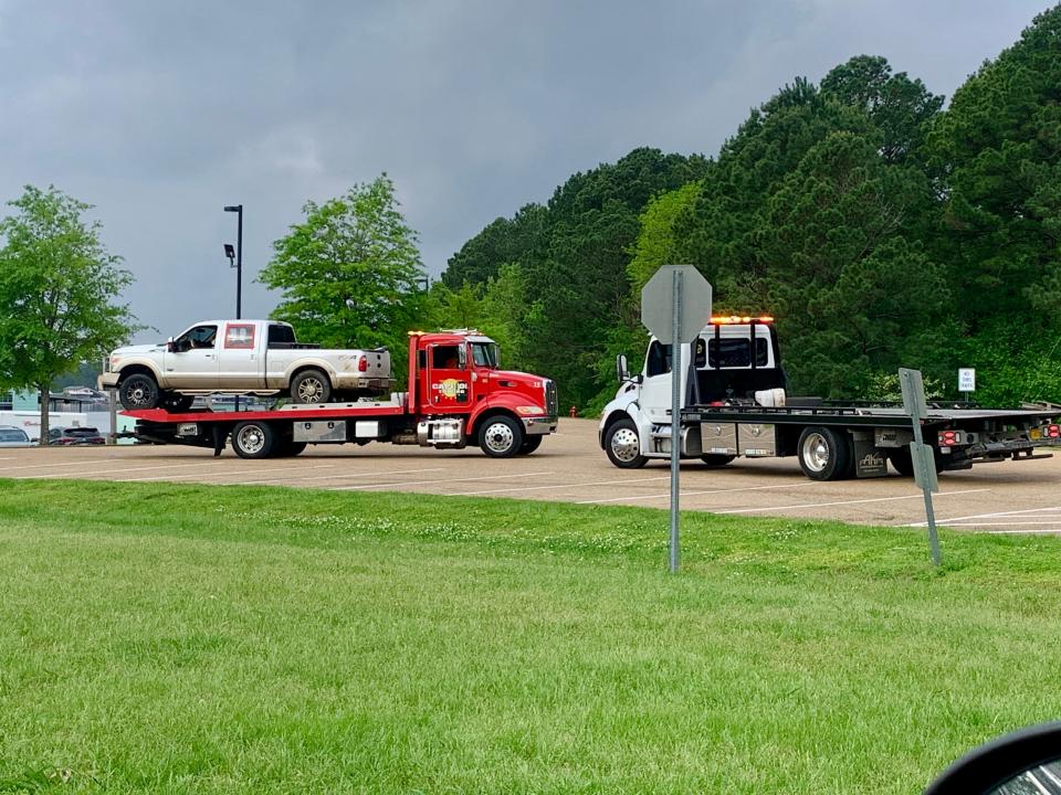 A Ford F-150 FX4, dripping water, was placed on a tow truck Thursday morning near Red Dot Road on the Ross Barnett Reservoir.