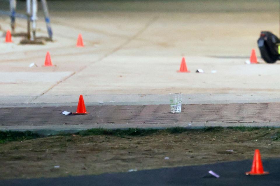 PHOTO: Evidence markers are pictured outside a building at Morgan State University after a shooting, Oct. 4, 2023, in Baltimore. (Julia Nikhinson/AP)