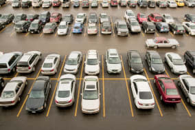 View of parking lot with classic cars.