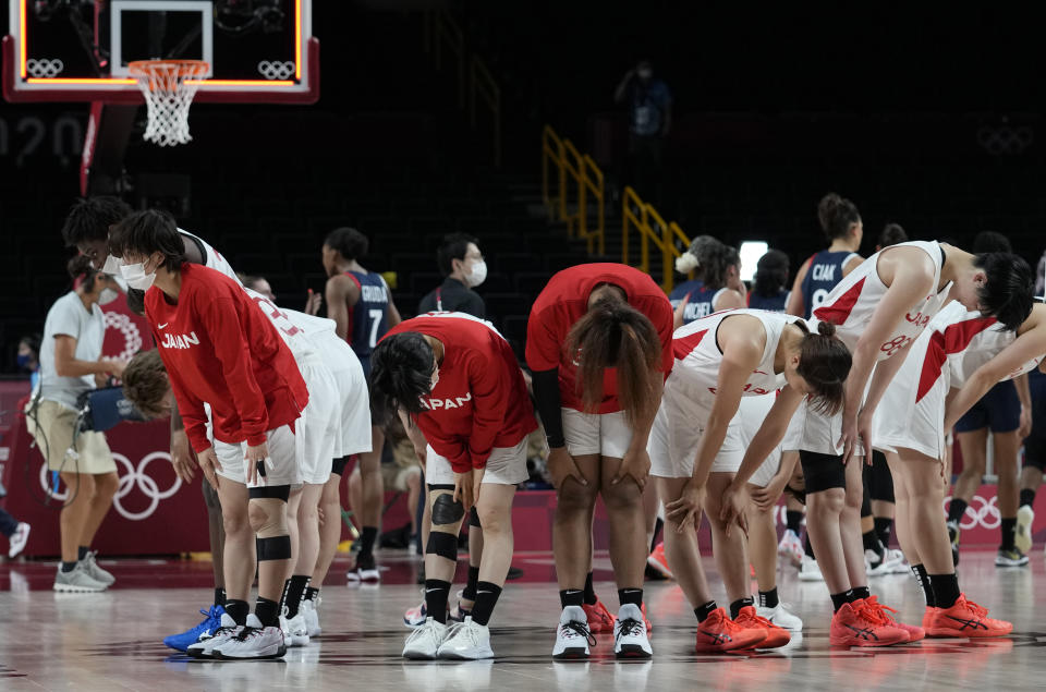 Members of team Japan bow after their win in the women's basketball preliminary round game against France at the 2020 Summer Olympics, Tuesday, July 27, 2021, in Saitama, Japan. (AP Photo/Eric Gay)