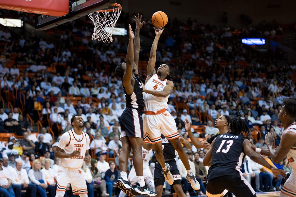 UTEP's Corey Camper Jr. (4) shoots the ball at a men's basketball game against NMSU on Saturday, Feb. 10, 2024, at the Don Haskins Center in El Paso, Texas.