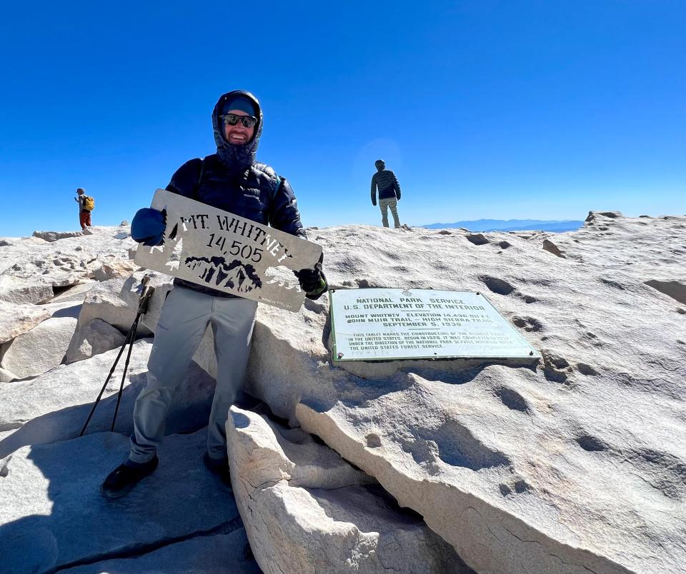 Mark Woods stands atop Mt. Whitney, the highest point in the contiguous United States, at the end of a hike on part of the John Muir Trail in September 2022.