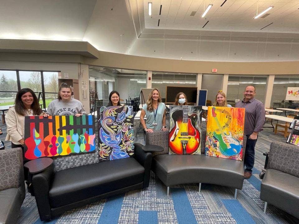 Hudson High School art students were invited by Fleet Response to create art for the company's new office space in Hudson.Pictured from left are:  Julie Mawaka (Fleet Response;, students Kathryn Palmieri, and Megan Zhao; Carolyn Huber (art teacher); students Evian Czirok and Audra Lozina; and Scott Mawaka (Fleet Response).