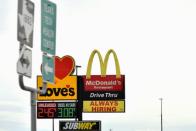 A sign soliciting applicants is seen outside of a truck stop in Midland