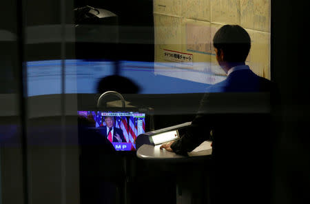 FILE PICTURE: A monitor showing U.S. President-elect Donald Trump speaking on TV is seen at the Tokyo Stock Exchange in Tokyo, Japan, November 10, 2016. REUTERS/Toru Hanai/File Photo