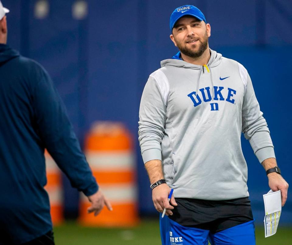 Duke defensive coordinator Tyler Santucci talks with head coach Mike Elko during the Blue Devils’ spring practice on Friday, March 24, 2023 in Durham, N.C.