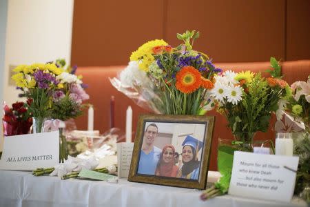 A makeshift memorial for Deah Shaddy Barakat, his wife Yusor Mohammad and Yusor's sister Razan Mohammad Abu-Salha, who were killed by a gunman, is pictured inside of the University of North Carolina School of Dentistry, in Chapel Hill, North Carolina February 11, 2015. REUTERS/Chris Keane