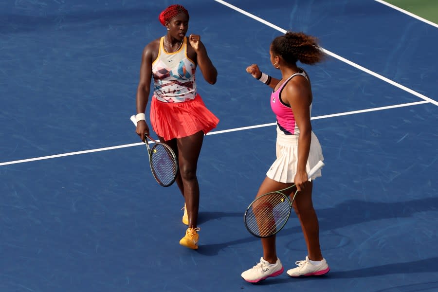 (Left to right) Clervie Ngounoue of the United States and partner Robin Montgomery of the United States celebrate a point against Shuko Aoyama of Japan and Ena Shibahara of Japan during their Women’s Doubles First Round match on Day Three of the 2023 U.S. Open at the USTA Billie Jean King National Tennis Center on Aug. 30, 2023, in the Flushing neighborhood of the Queens borough of New York City. (Photo by Clive Brunskill/Getty Images)